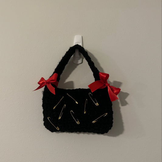 Accessorized black handbag
